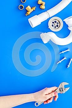 Plumber work with instruments, tools and gear on blue background top view mockup