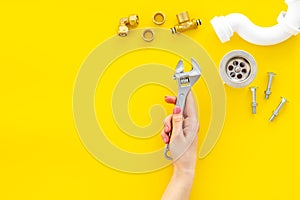 Plumber work with instruments, tools and gear on yellow background top view mock up