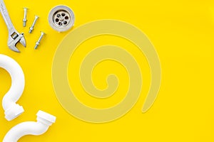 Plumber work with instruments, tools and gear on yellow background top view mock up