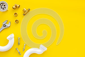 Plumber work with instruments, tools and gear on yellow background top view mockup