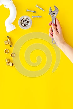 Plumber work with instruments, tools and gear on yellow background top view mockup