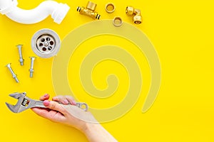 Plumber work with instruments, tools and gear on yellow background top view mockup