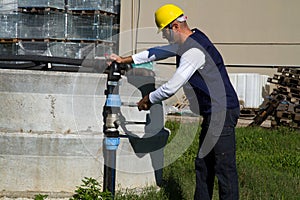 Plumber at work in a site