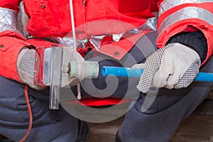 Plumber at work in a site