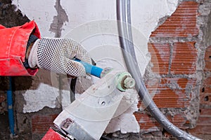 Plumber at work in a site