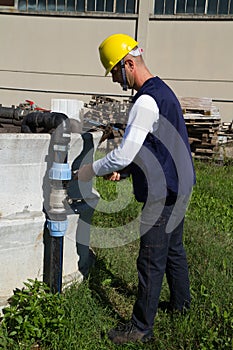 Plumber at work in a site