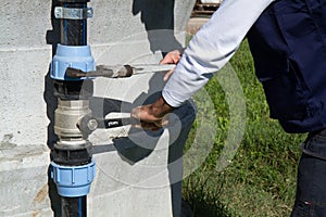 Plumber at work in a site