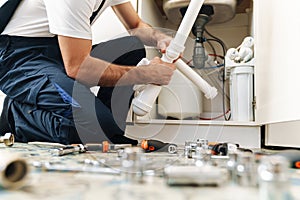 Plumber work in uniform indoors