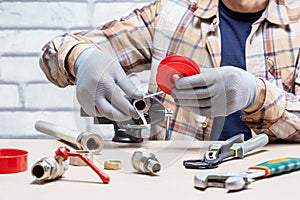 Plumber work on workbench. p