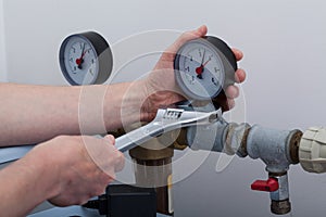Plumber during work with wrench