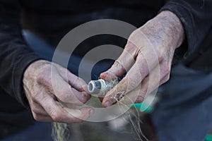 Plumber working on pipe connector