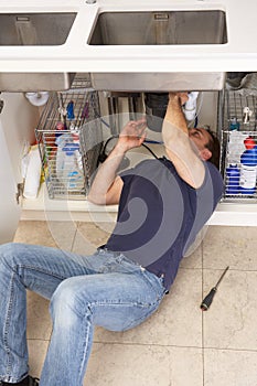 Plumber Working On Sink