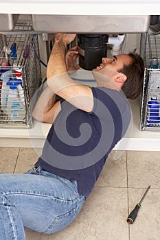 Plumber Working On Sink