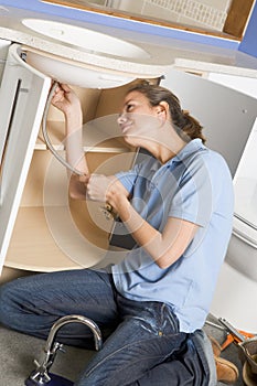 Plumber working on sink