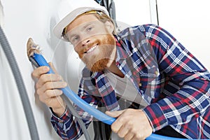 plumber working on wall photo