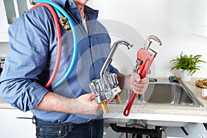 Plumber with a wrench.