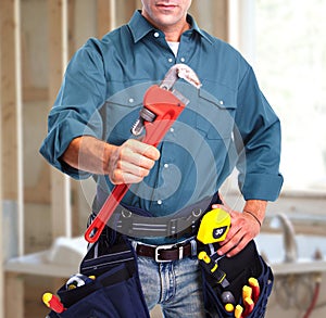 Plumber with wrench.