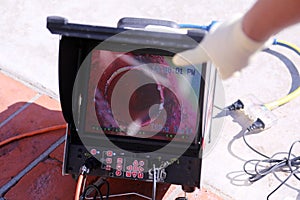 Plumbers sewer snake camera. a snake camera checks the inside of a sewer drain to make sure its clear of blockage and or damage.