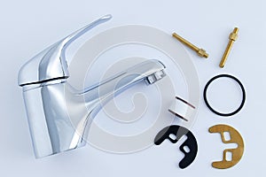 Plumbing chrome faucet and fixing set with gasket on white background