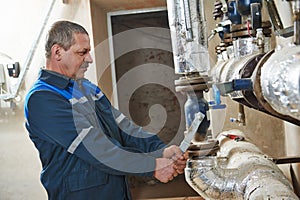 Plumbing heating engineer repairman in boiler room