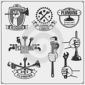 Plumbing and home renovation services emblems with working tools. Logos template and design elements.
