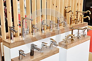 Plumbing and kitchen faucets at exhibition in store