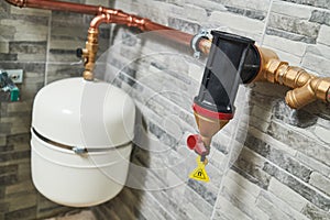 Plumbing service. copper pipeline and expansion vessel of a heating system in boiler room