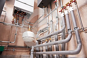 Plumbing service. Hot water boiler room with heating system equipment