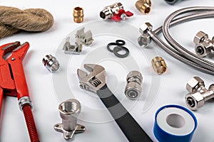 Plumbing services - tools and accessories on white background