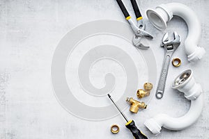 Plumbing work concept with pipes and tools, top view