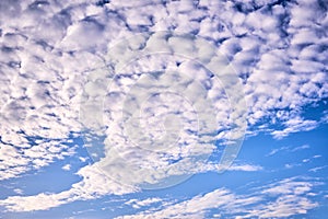 Plume of clouds on the blue sky.