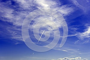 Plume from the plane against the beautiful sky