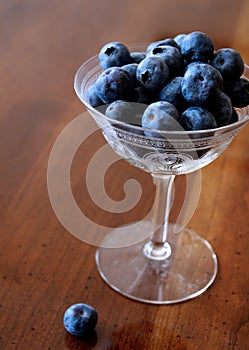 Ripe Blueberries in a Delicate Vintage Champagne Glass
