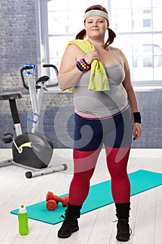 Plump young woman at the gym photo