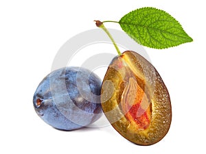 Plums with green leaf