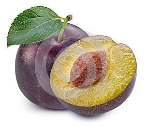 Plums half with leaves isolated