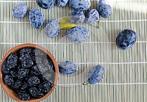 Plums `prunes` dried plums on white background