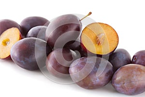 Plums on white