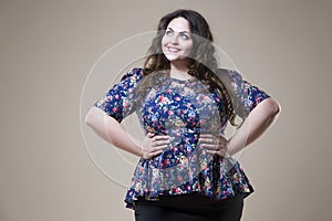 Plus size fashion model in casual clothes, fat woman on studio background, overweight female body