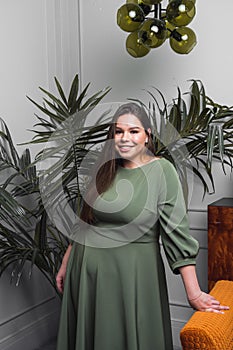 Plus size fashion model in casual clothes, woman on studio background, overweight female body