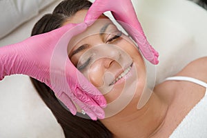 Plus size woman getting face massage