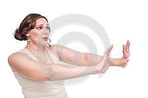 Plus size woman making refuse gesture