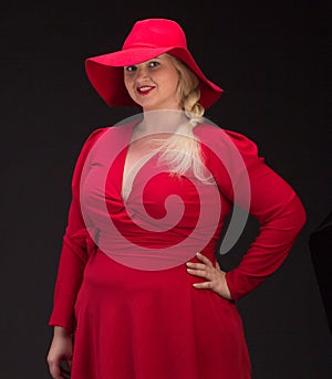 plus size woman in red hat with red lips.