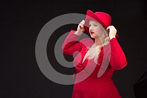 plus size woman in red hat with red lips.