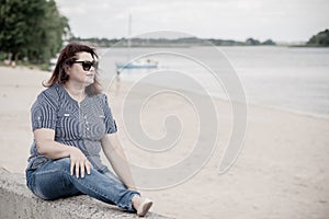 Plus size woman thinking about something, lifestyle