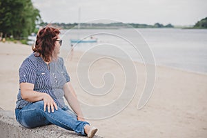 Plus size woman thinking about something, lifestyle