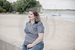 Plus size woman thinking about something, lifestyle