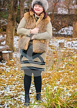 Plus size woman at winter day, lady in furs