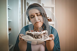 Plus Size Woman Woman Admires Chocolate Cake