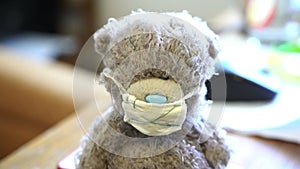 Plush toy teddy bear with medical mask putting on it, virus, influenza, infection protection, emidepia, pandemia, panic